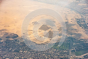 The Giza pyramid complex, also called the Giza Necropolis viewed from airplane window