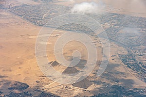 The Giza pyramid complex, also called the Giza Necropolis viewed from airplane window