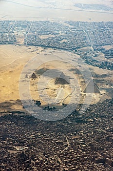 The Giza pyramid complex, also called the Giza Necropolis viewed from airplane window