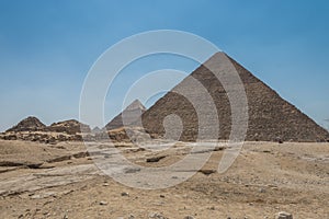 The Giza pyramid complex, an archaeological site on the Giza Plateau, on the outskirts of Cairo, Egypt. It includes the three