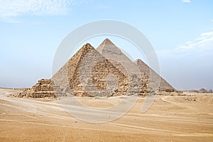 Giza pyramids in Cairo, Egypt. General view of pyramids from the Giza Plateau Three satellite pyramids on front side. Next in