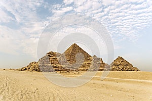 Giza pyramids in Cairo, Egypt. General view of pyramids from the Giza Plateau Three satellite pyramids on front side. Next in