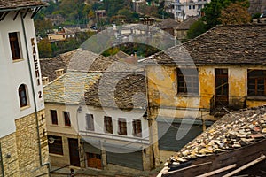 GJIROKASTRA, ALBANIA: Top view of the old roofs of houses in the city of Gjirokastra.