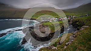 Gjogv gorge and town on the island of Eysturoy in the Faroe Islands. TIme lapse