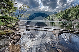 Glacial Black Lake surrounded by the forest