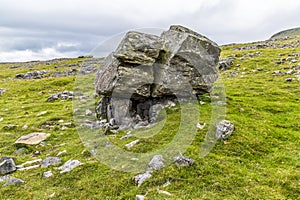 A glacial erratic deposited on limestones base on the southern slopes of Ingleborough, Yorkshire, UK