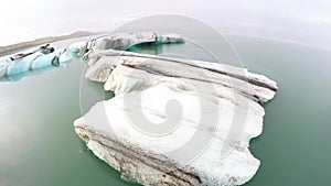 Glacial ice and old glacier in Iceland - wide angle aerial view