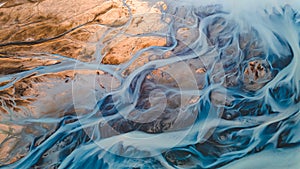 A glacial rivers from above. Aerial photograph of the river streams from Icelandic glaciers. Beautiful art of the Mother nature