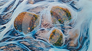 A glacial rivers from above. Aerial photograph of the river streams from Icelandic glaciers. Beautiful art of the Mother nature