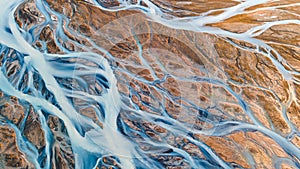 A glacial rivers from above. Aerial photograph of the river streams from Icelandic glaciers. Beautiful art of the Mother nature