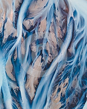 A glacial rivers from above. Aerial photograph of the river streams from Icelandic glaciers. Beautiful art of the Mother nature