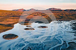 A glacial rivers from above. Aerial photograph of the river streams from Icelandic glaciers. Beautiful art of the Mother nature