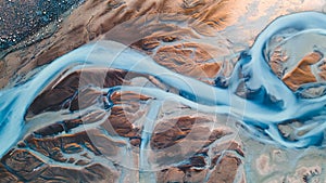 A glacial rivers from above. Aerial photograph of the river streams from Icelandic glaciers. Beautiful art of the Mother nature