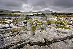 Glaciated karst landscape of the Burren with Mullaghmore Mountain, County Cork, Ireland photo