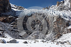 Glacier above dangerous rocky cliff, Himalayas, Nepal