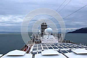 Top of a cruise ship with a view of Glacier Bay on a cloudy morning