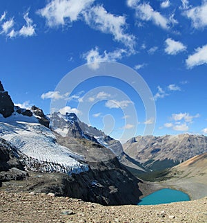 Glacier and blue mountain lake