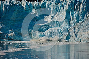 Glacier calves into the Ocean in Glacier Bay National Park.