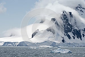 Glacier And Clouds Covering The Coastline Of Paradise Bay, Antarctic Peninsula