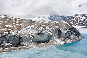 Glacier coming into Tilicho lake in Himalayas.