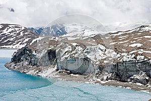 Glacier coming into Tilicho lake in Himalayas. photo