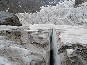 Glacier huge crevasse in Svanetia Caucasian mountains in Georgia