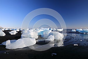 Glacier ice chunks on the black beach at Jokulsarlon, Iceland