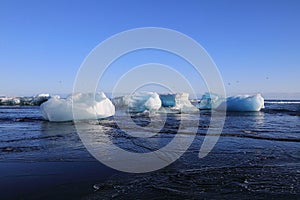 Glacier ice chunks on the black beach at Jokulsarlon, Iceland