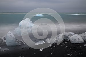 Glacier ice chunks on the black beach at Jokulsarlon, Iceland