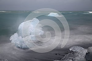 Glacier ice chunks on the black beach at Jokulsarlon, Iceland