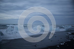 Glacier ice chunks on the black beach at Jokulsarlon, Iceland