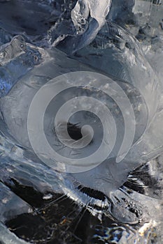 Glacier ice chunks on the black beach at Jokulsarlon, Iceland photo