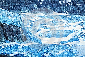 Glacier with icefall on a mountain at high altitude