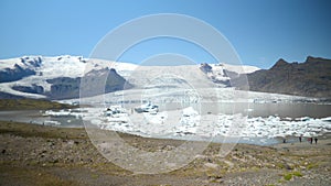 Glacier lake with plenty of icebergs at Fjallsarlon at a sunny day