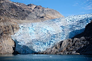 Glacier reaches the sea in Prins Christian Sund, South Greenland photo