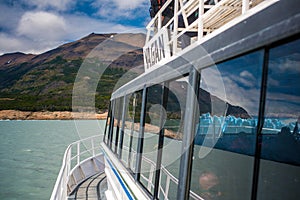 The glacier is reflected in the ship window. Shevelev.