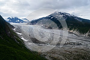 Glacier with Snow Covered Mountains