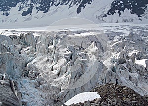 Glacier on Tetnuldi mountain, rocky peaks with snow in Svanetia Caucasian mountains in Georgia
