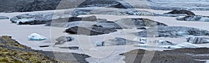 Glacier tongue slides from VatnajÃ¶kull icecap or Vatna Glacier near subglacial Ã–rÃ¦fajÃ¶kull volcano, Iceland. Glacial lagoon