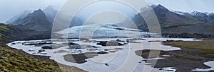 Glacier tongue slides from VatnajÃ¶kull icecap or Vatna Glacier near subglacial Ã–rÃ¦fajÃ¶kull volcano, Iceland. Glacial lagoon