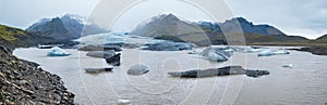 Glacier tongue slides from VatnajÃ¶kull icecap or Vatna Glacier near subglacial Ã–rÃ¦fajÃ¶kull volcano, Iceland. Glacial lagoon