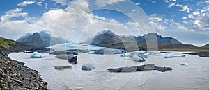 Glacier tongue slides from VatnajÃ¶kull icecap or Vatna Glacier near subglacial Ã–rÃ¦fajÃ¶kull volcano, Iceland. Glacial lagoon