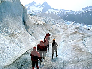 Glacier trekkers along stream