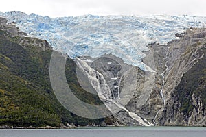 Glacier and Waterfall in Remote Mountains