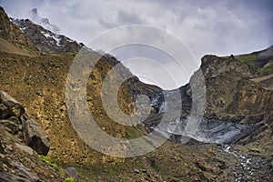 The glaciers covered by the old volcanic rock descend to the edge of Shimshal village, bringing with them the water