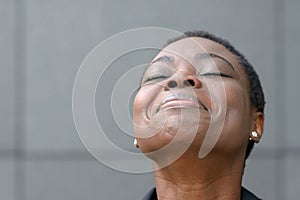 Glad African American woman close-up portrait photo