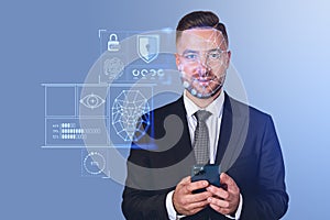 Glad businessman in formal suit holding smartphone with facial r