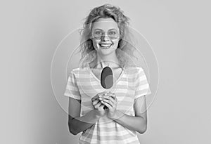 glad girl with icecream in studio. girl with icecream on background