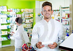 Glad man druggist in white coat