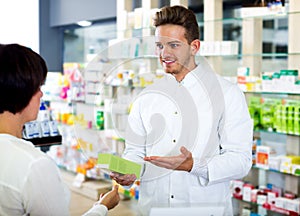 Glad man druggist in white coat